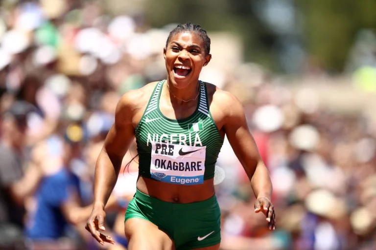 Blessing Okagbare, a top Nigerian female athlete, sprinting to victory in a track and field event.