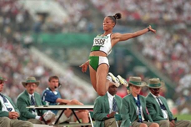 15 Inspirational Female Athletes in Nigeria: Chioma Ajunwa, a remarkable Nigerian female athlete sprinting to victory in a track and field event.