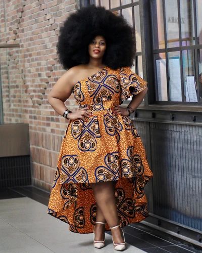 Ankara Gown Styles for Plus-Size Ladies in 2023: An elegant model showcases a High-Low Ankara Gown with striking African patterns, exemplifying the modern allure of African fashion.