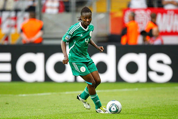 Perpetua Nkwocha, an iconic Nigerian female footballer, demonstrating her phenomenal skills on the playing field.
